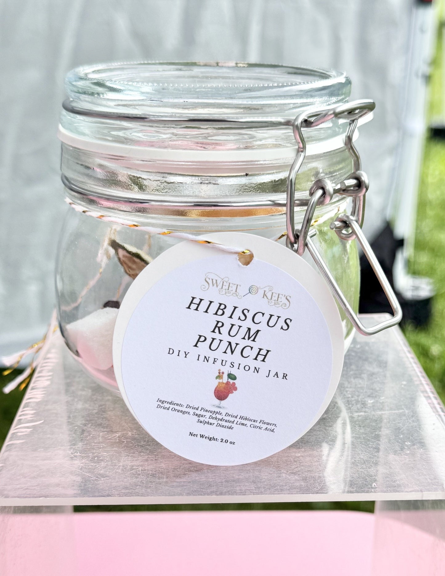 Glass jar with hibiscus rum punch cocktail infusion ingredients. Just add rum.