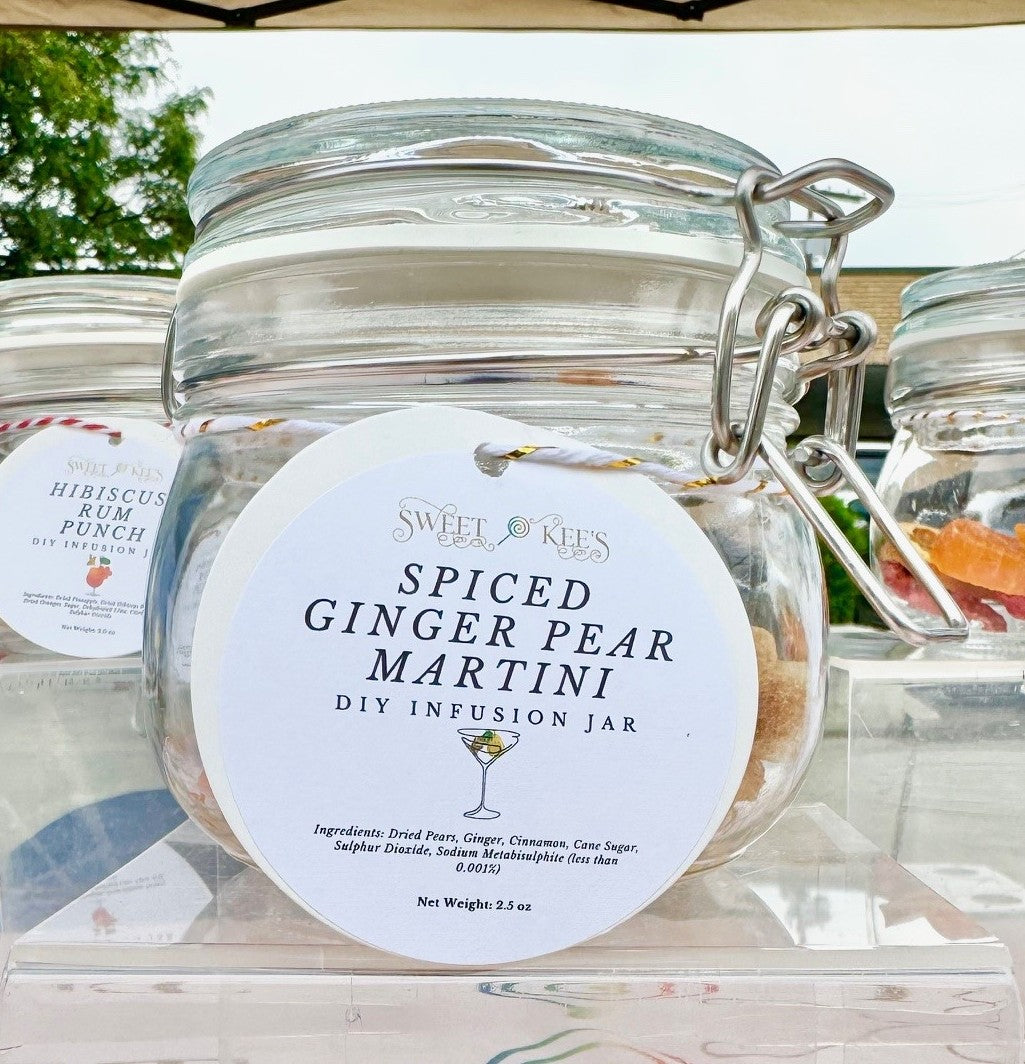 Glass jar with infusion ingredients to make a Spiced Ginger Pear Martini when vodka or gin is added