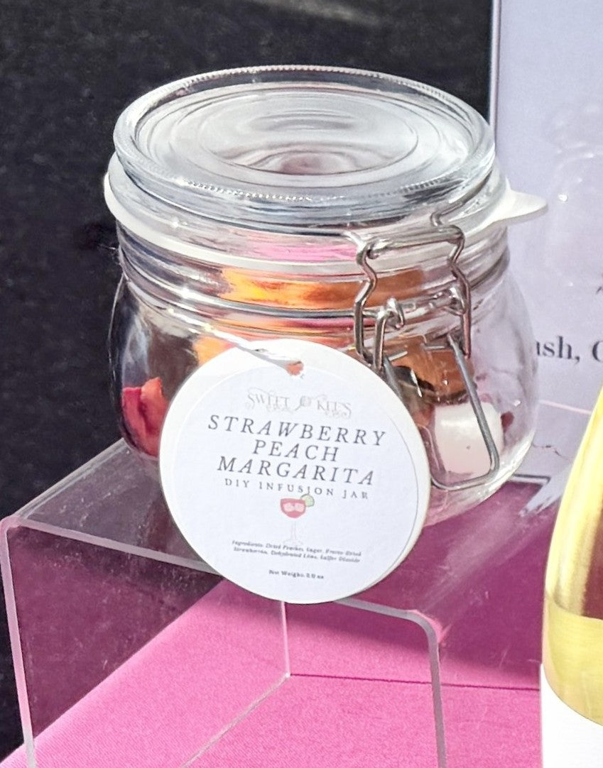 Glass jar with strawberry peach margarita cocktail infusion ingredients. Just add tequila.